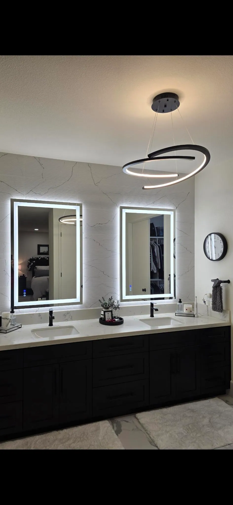 Modern bathroom ceiling fixture and illuminated mirrors